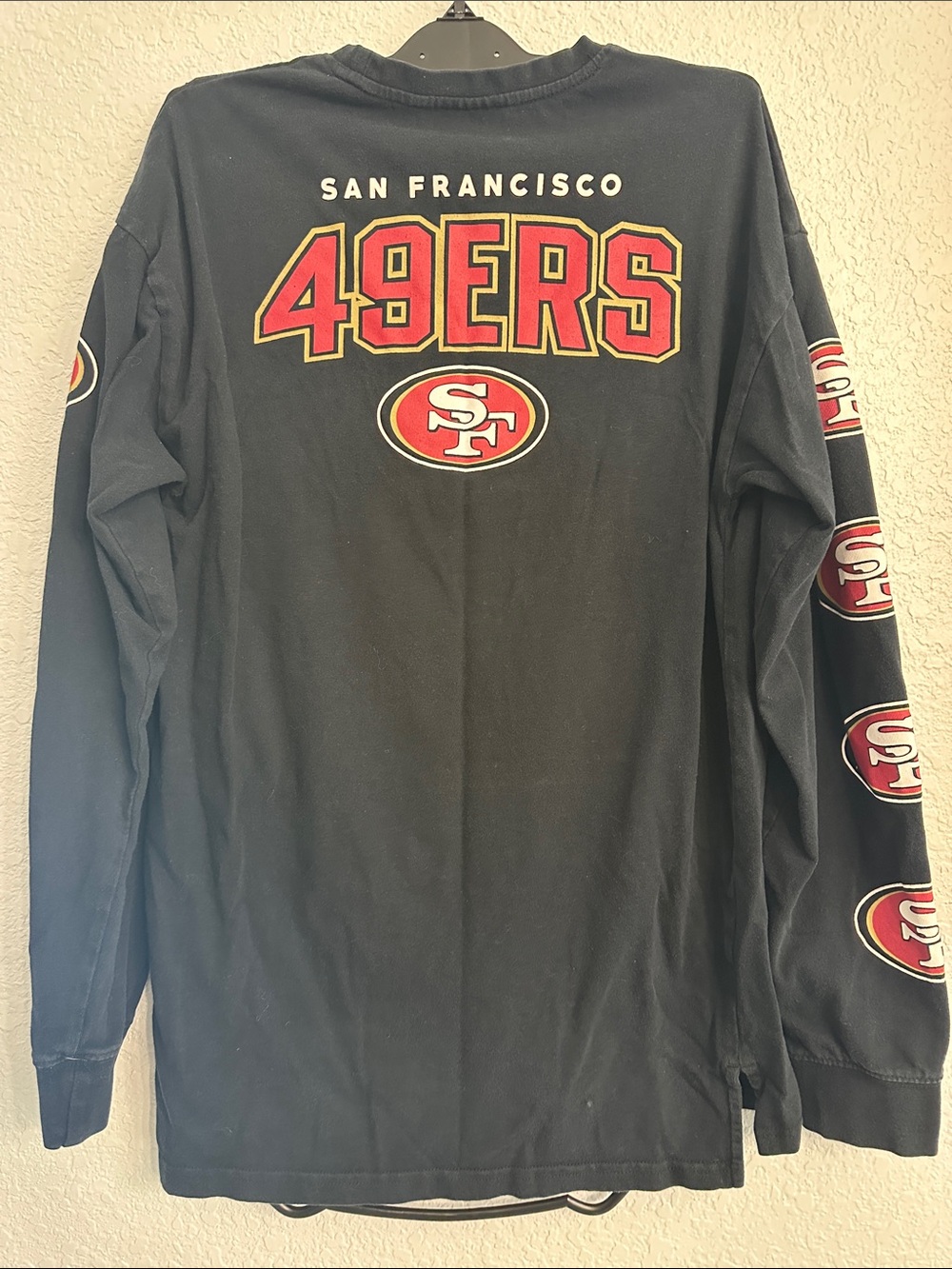 NFL Black Long Sleeve Crewneck Shirt with Red Sleeve Logos